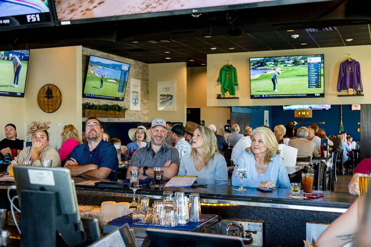 People enjoying themself at the bar watching the Masters Golf Tournament at Lakewood Tavern in Lake Elmo, MN